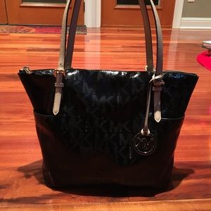 A black Michael Kors Purse